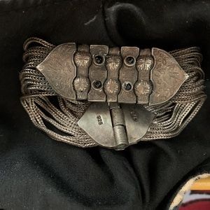 Silver etched bracelet with black stones